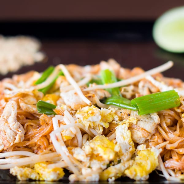 Close-up of Hibachi Boy's Japanese noodles with chicken, scrambled egg, bean sprouts, and green onions.