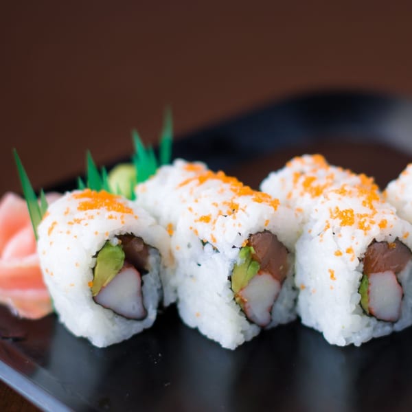 Hibachi Boy's sushi rolls with crab, avocado, and tuna, topped with orange roe.