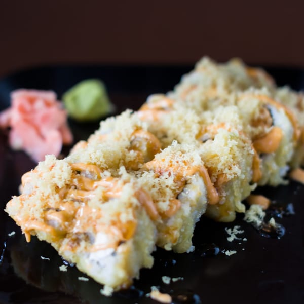 Hibachi Boy's crispy sushi rolls with spicy mayo and tempura flakes, served with ginger and wasabi.